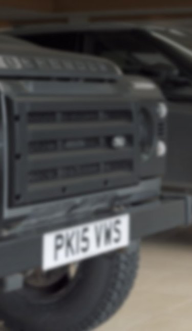 frontend of two dark blurry cars at jaguar land rover