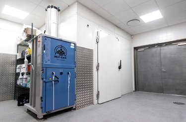 blue baler in tidy back room showing that a baler is worth it