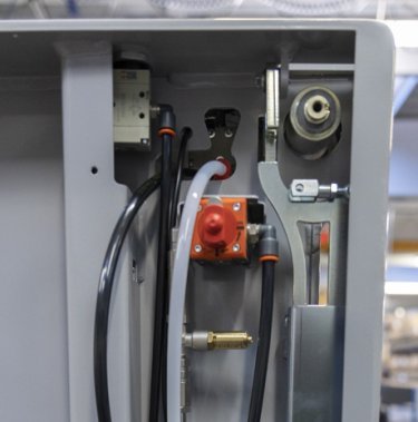 close up of parts on a baler that needs regular service