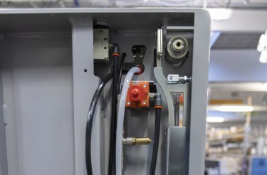 close up of parts on a baler that needs regular service