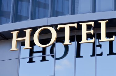 The text ‘hotel’ on the facade of a building