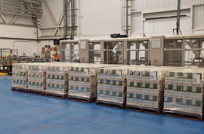 pallets with pet food on blue floor