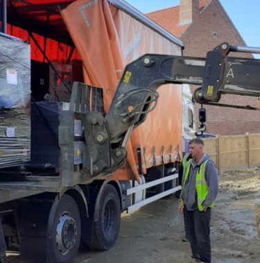 baler arriving with truck to truelove properties